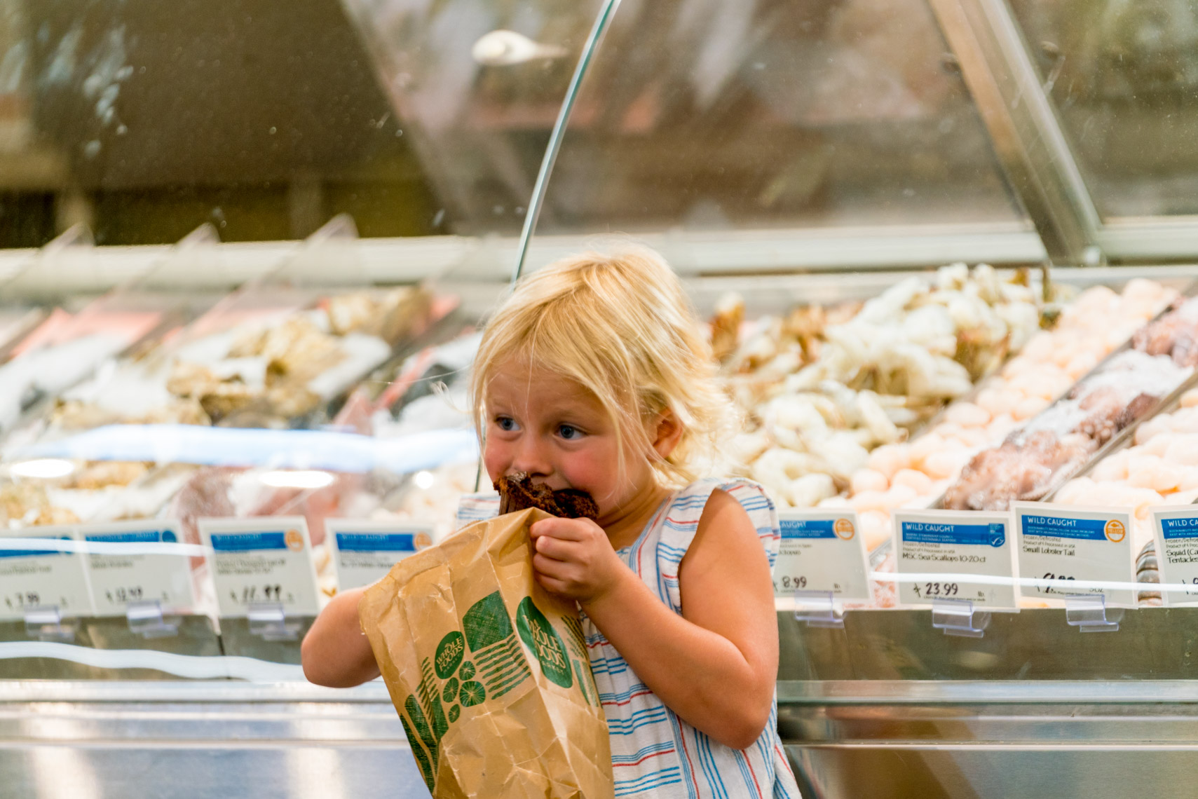 little girl eating muffin fish mkt2